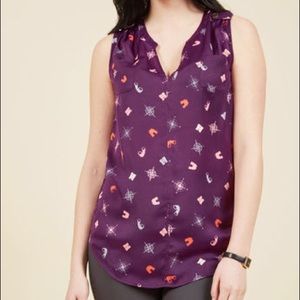 Sleeveless ModCloth shirt in Travel print.